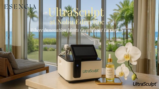 A spa treatment room with a view of the ocean, featuring the UltraSculpt machine, a bottle, and an orchid.
